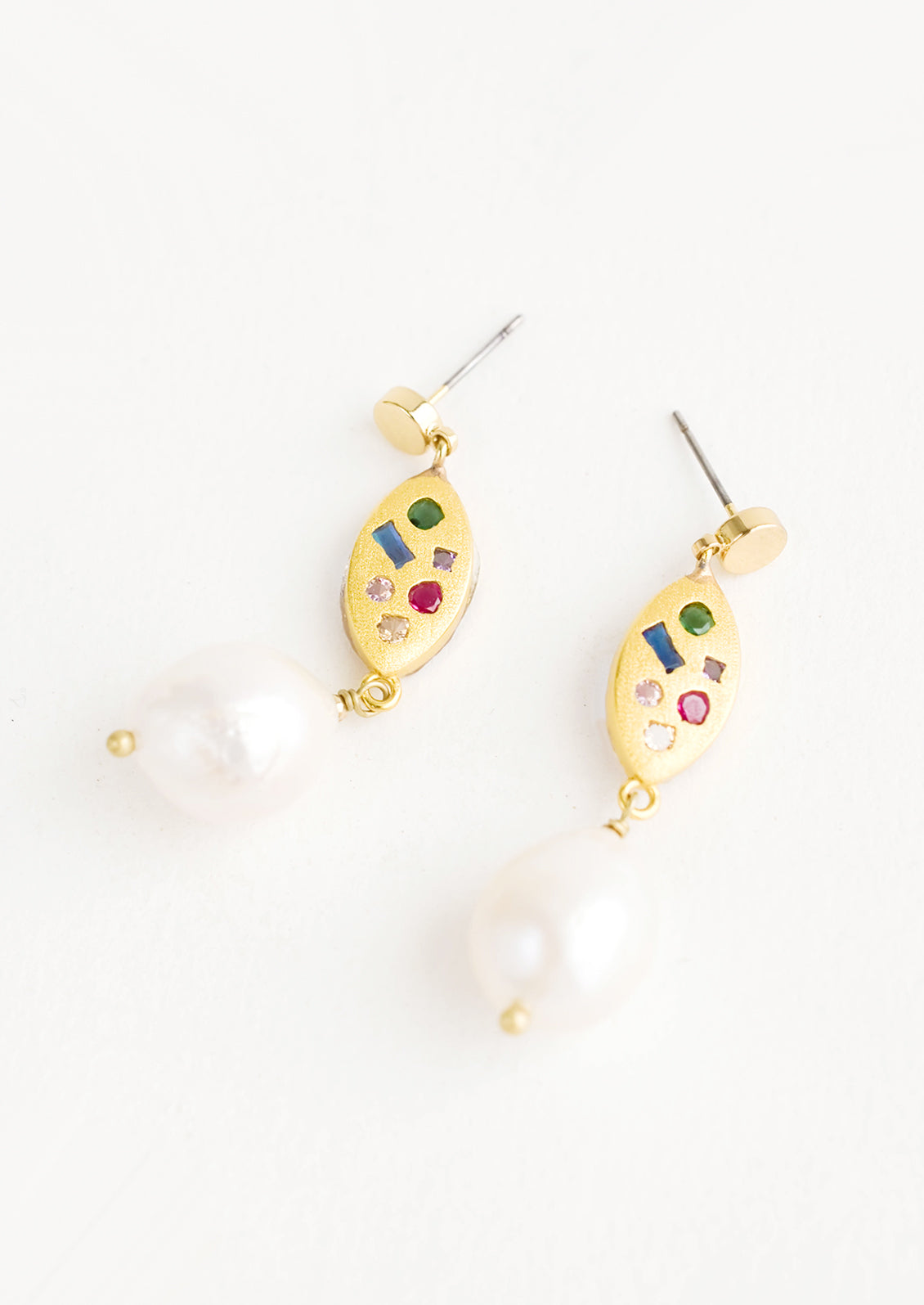 Dangle earrings with round gold post, gold baguette middle with embedded gemstones, pearl bead bottom