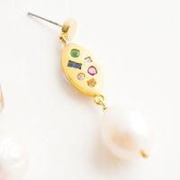 2: Dangle earrings with round gold post, gold baguette middle with embedded gemstones, pearl bead bottom