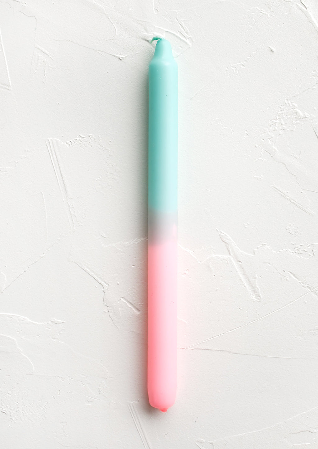 Mint / Pink: A straight taper candle in mint and pink.