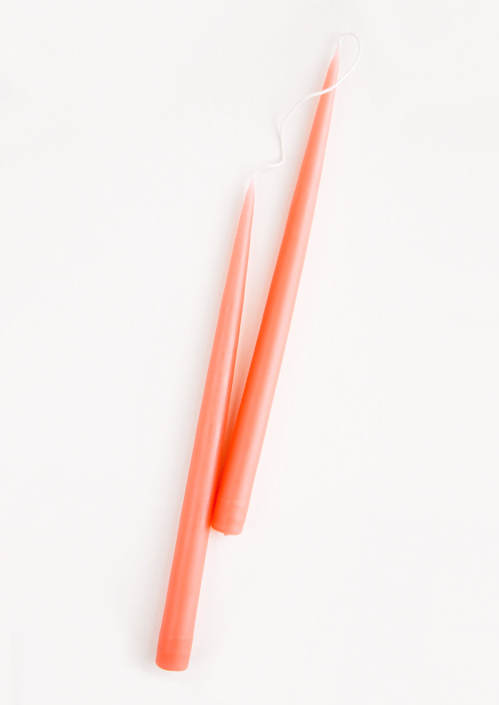 Coral: Pair of Two taper Candles in coral peach.