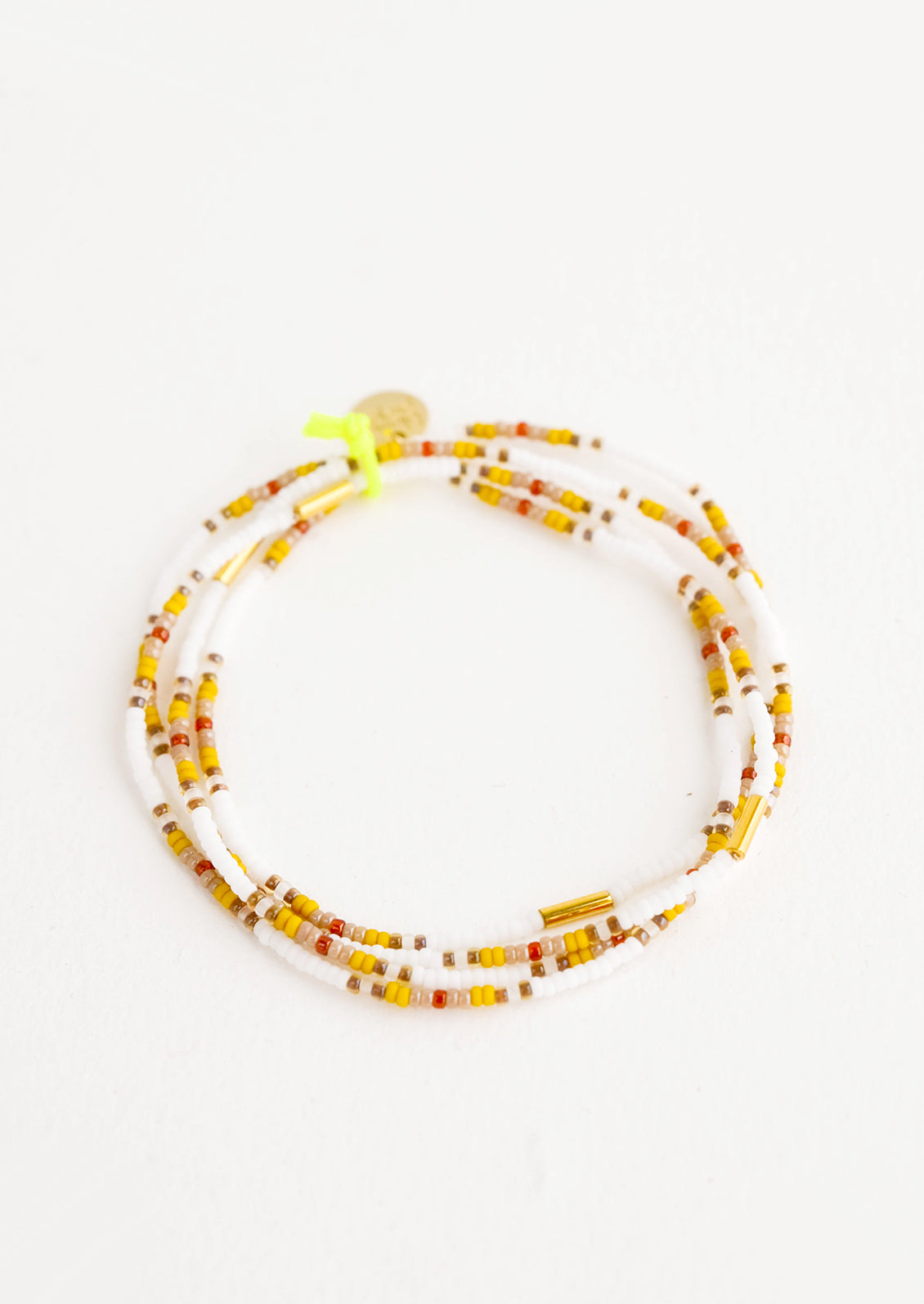 Set of four glass seed bead bracelets with brass accent bead