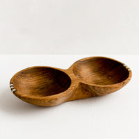 2: A double well wooden bowl with small bone detailing.