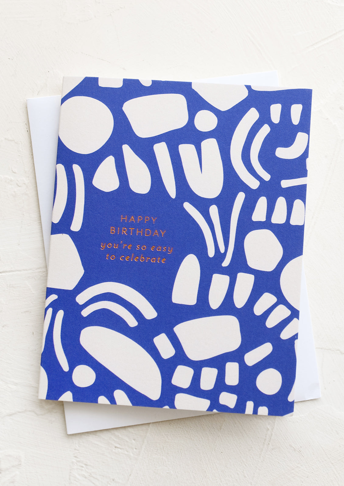 A card reading "happy birthday, you're so easy to celebrate".