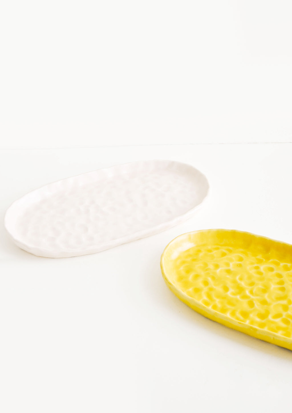 1: Dapple Textured Oval Shaped Ceramic Trays in Pink & Yellow - LEIF
