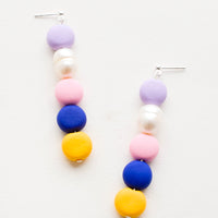 Navy Multi: Earrings with colorful clay beads stacked in a row mixed with one pearl bead
