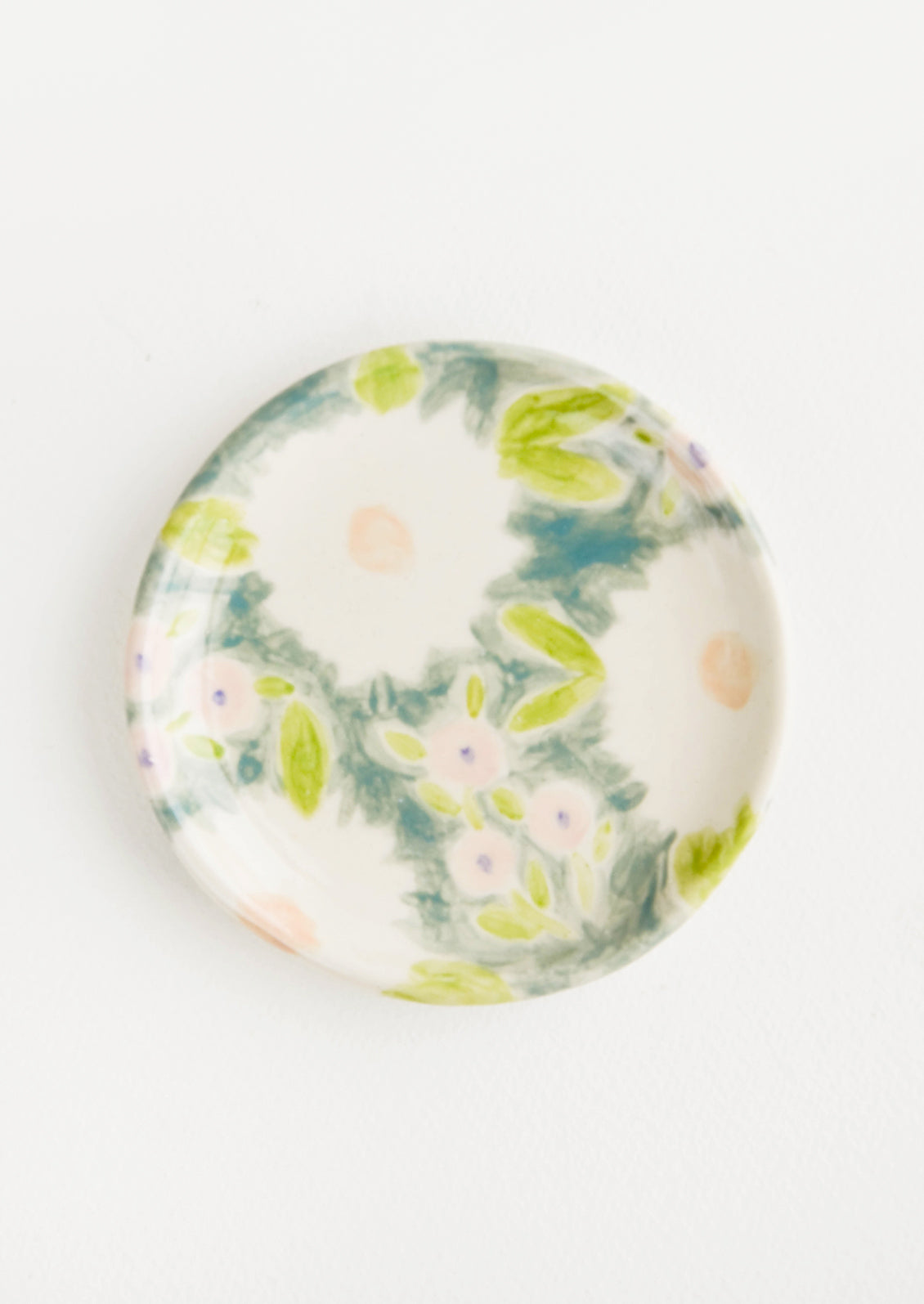 Small, round ceramic dish in whimsical floral print