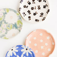 3: Round ceramic jewelry dishes in a mix of floral patterns