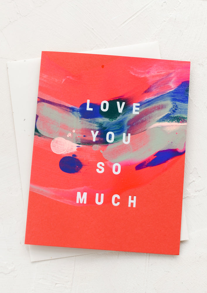 A painted greeting card reading "love you so much".