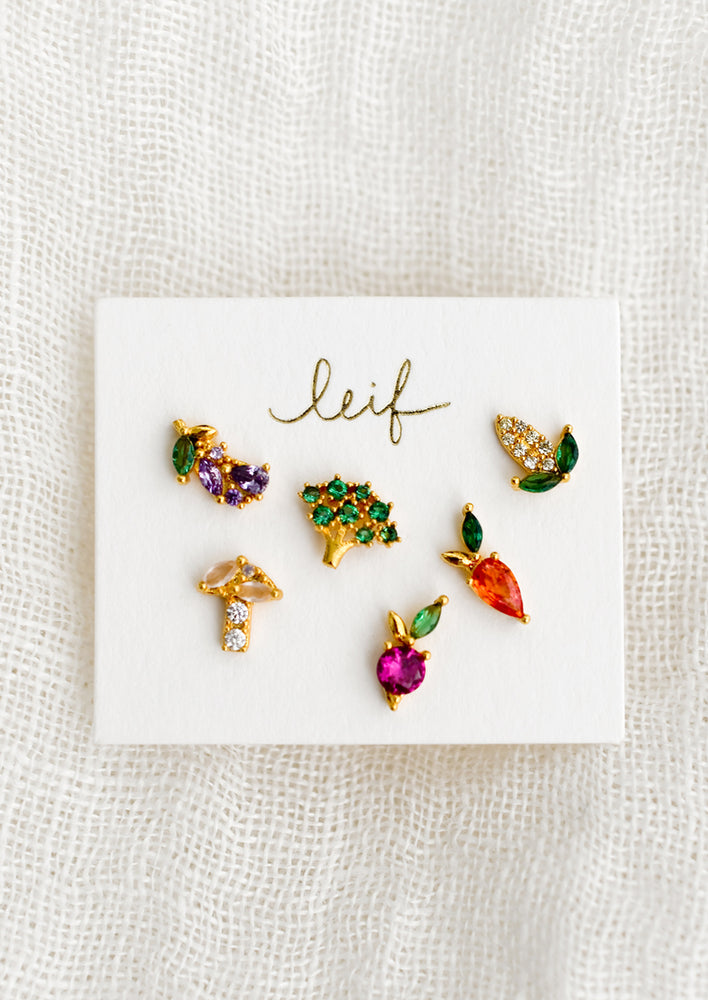1: Set of six veggie themed stud earrings made from colored crystals.