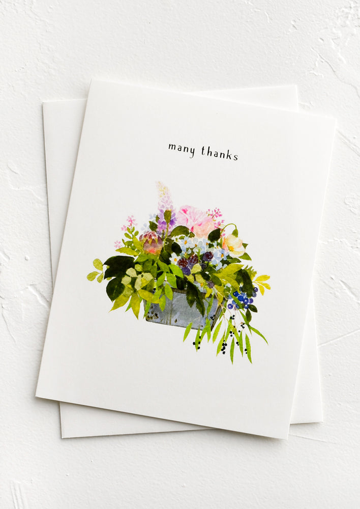 1: A greeting card with image of flowers in a planter and text above reading "many thanks".