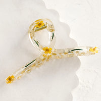 Yellow: A clear crescent shaped hair claw with yellow dried flowers.
