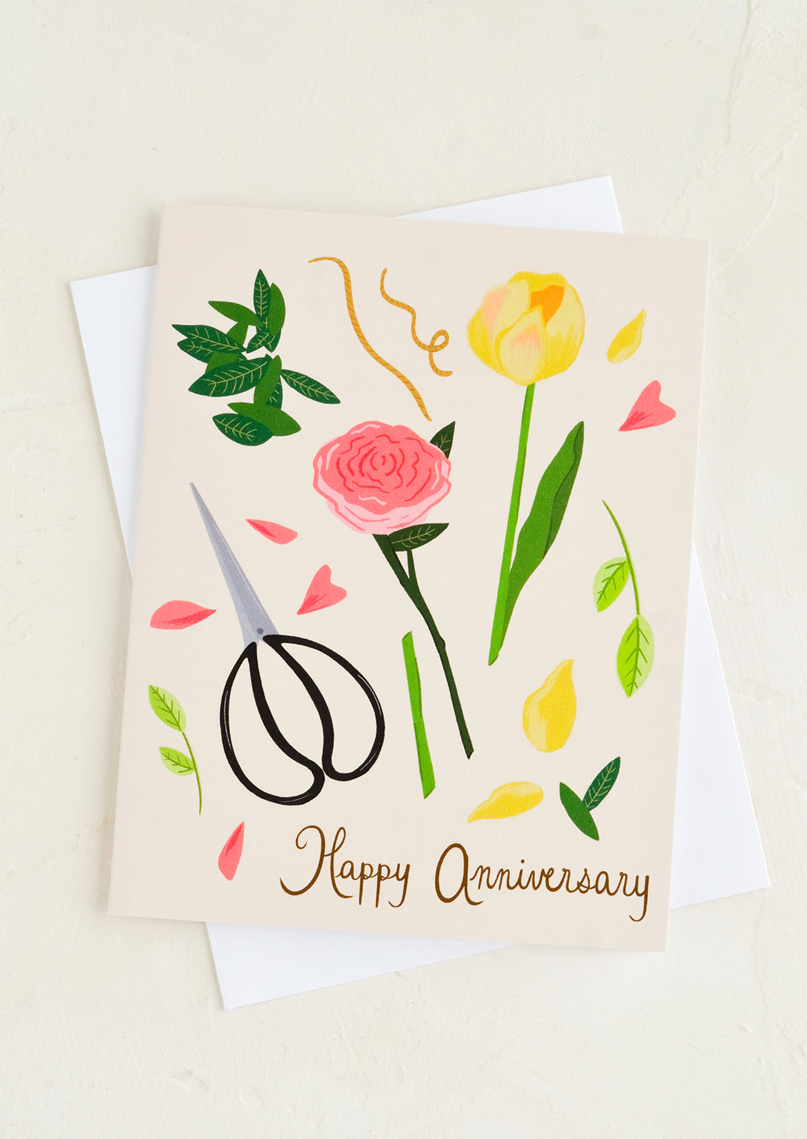 A "happy anniversary" greeting card with illustrated garden shears and flowers.