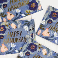 Boxed Set of 8: Greeting cards with blue floral print reading "happy hanukkah".
