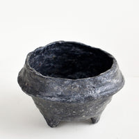Black: Small, decorative paper mache bowl in footed silhouette and black in color