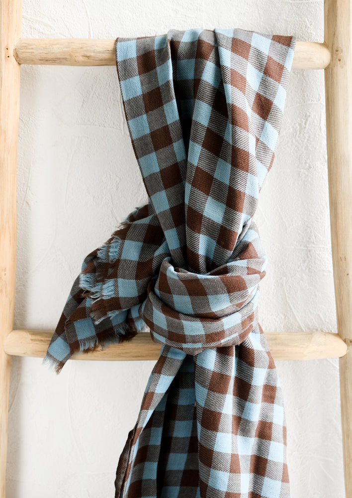 1: A scarf in blue and brown gingham checker print.