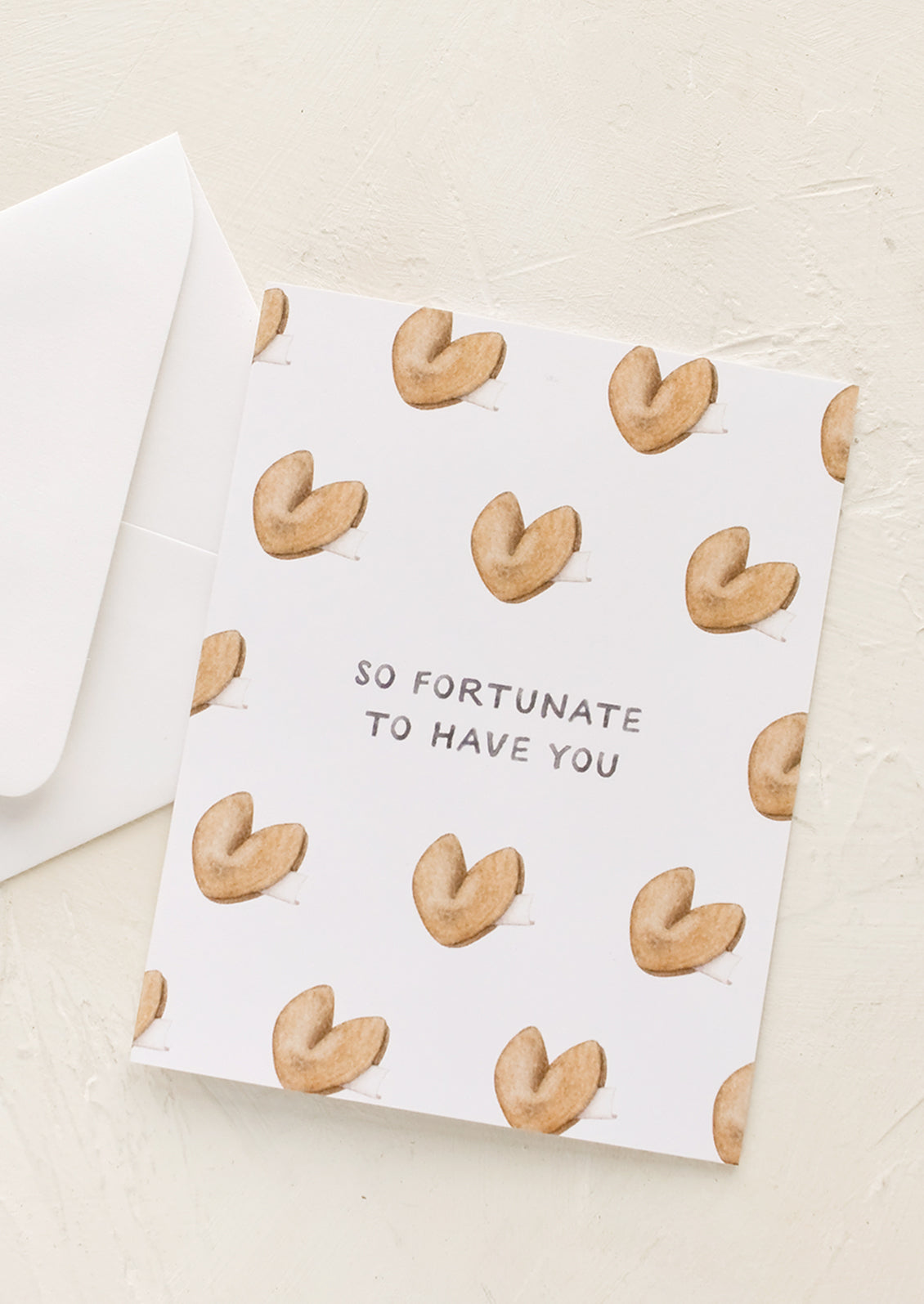 A greeting card with fortune cookie print.