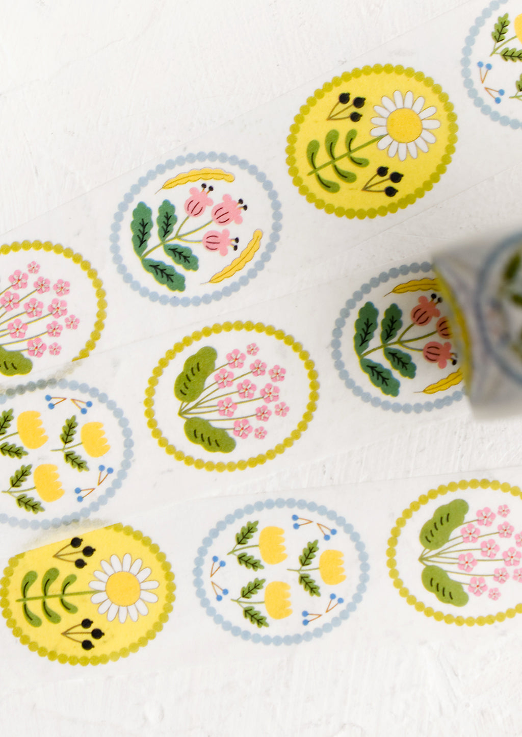 1: Pastel floral print washi tape in oval border shape.