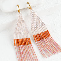Blush Multi: Beaded earrings featuring pink and rust beads layered into fringe, dangling from a gold hoop.