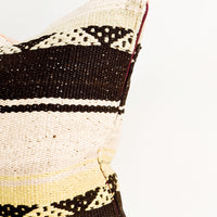 2: Square throw pillow in wool fabric with tan and black stripes, accents of orange and yellow.
