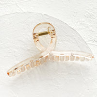 Pale Honey: A french twist acrylic hair clip in pale honey.