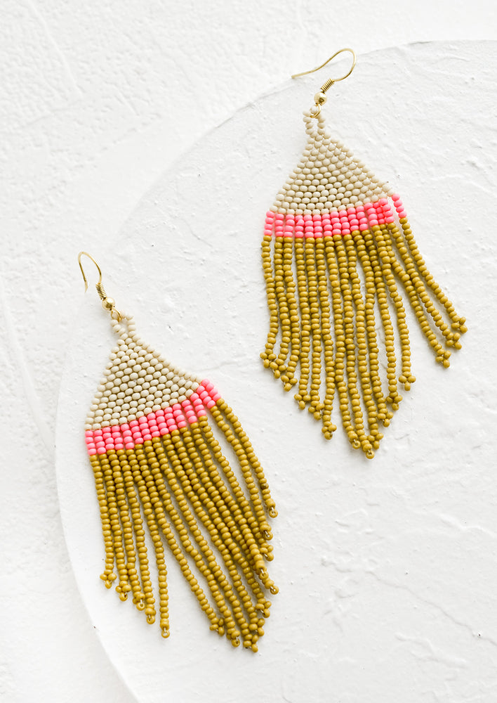 A pair of fringe beaded earrings with colorblock design in ivory, hot pink and chartreuse.