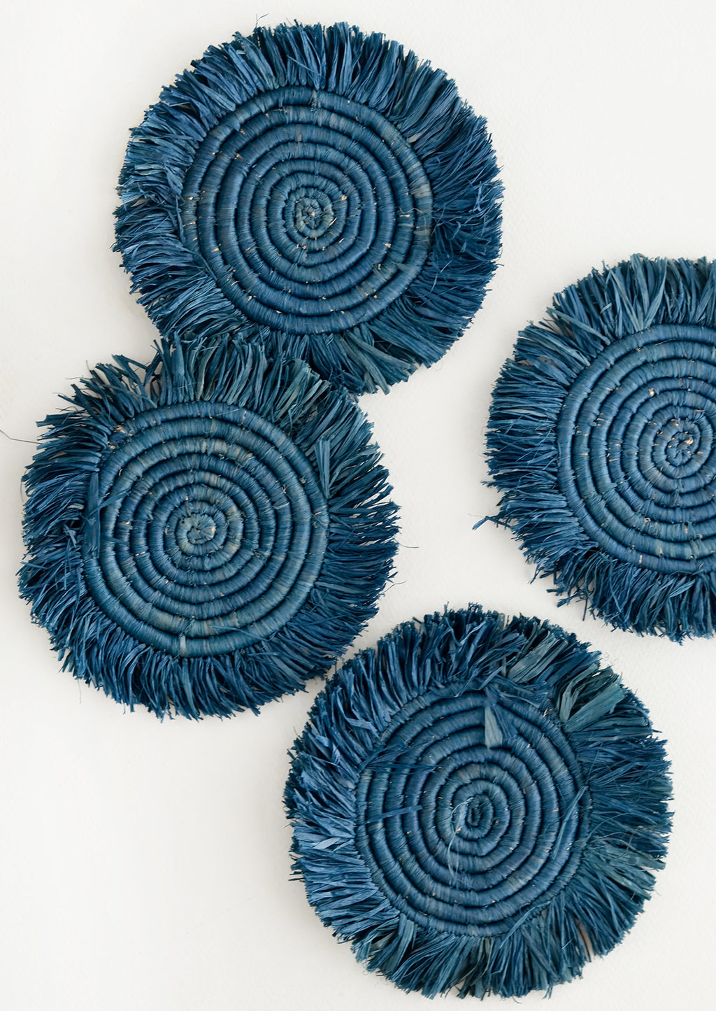 Coastal Blue: Set of 4 Circular Raffia Coasters with Fringed Trim in Coastal Blue