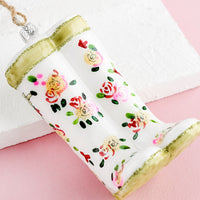1: A decorative glass ornament in the shape of floral print garden wellies.