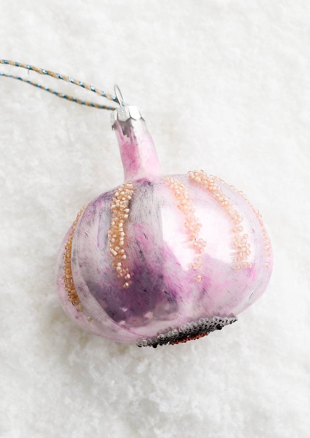 1: A decorative glass ornament in the shape of garlic bulb.