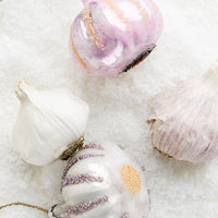 2: Garlic ornaments next to real garlic.