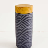 Stone Blue: Geometric textured ceramic tall travel tumbler in stone blue with bamboo lid