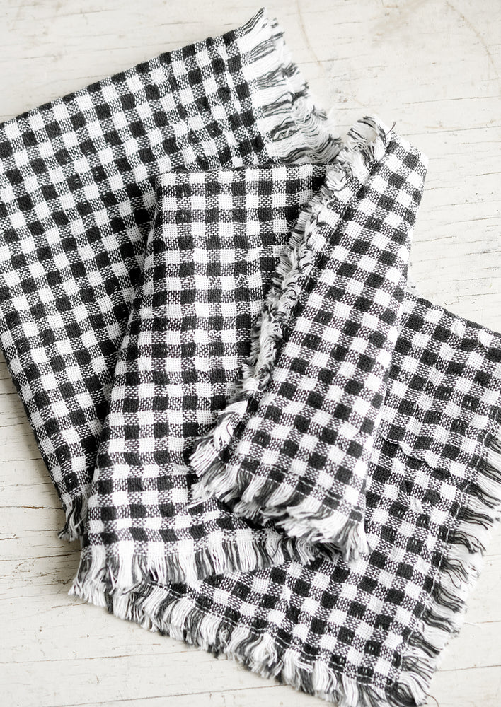 1: Cotton gingham napkins in black and white with frayed edges.