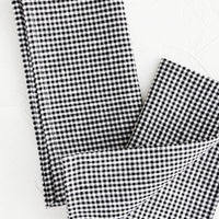 4: Pair of fabric dinner napkins in black and white gingham pattern