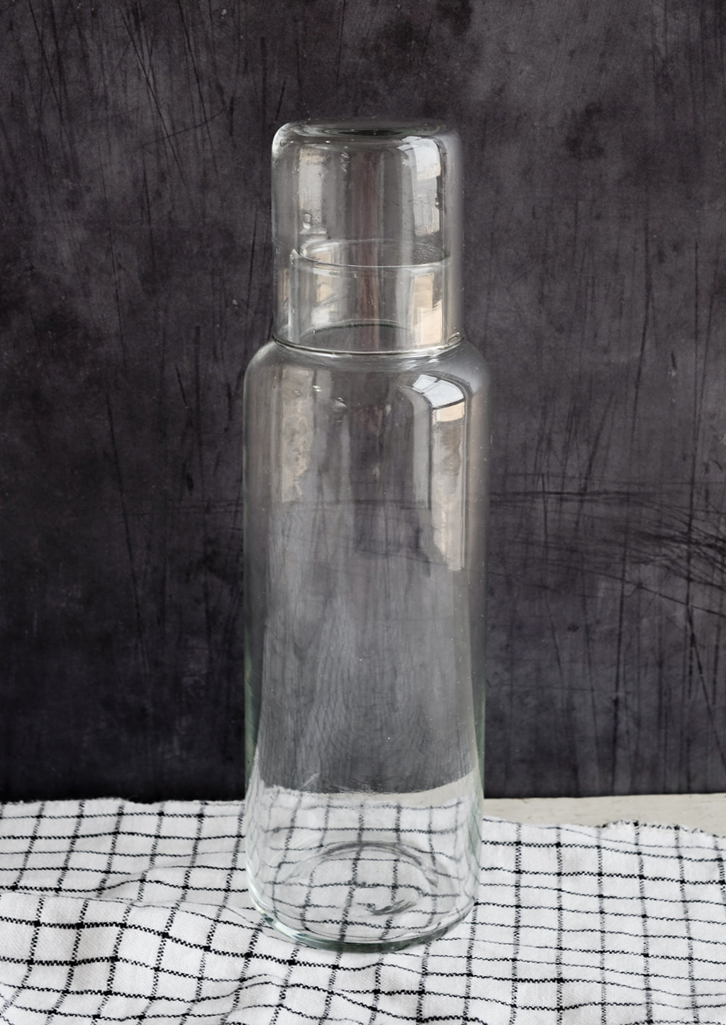 3: A tall glass decanter with small matching cup that doubles as a lid.