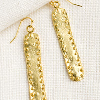 Long: A pair of long bar shaped earrings with raised dot border.