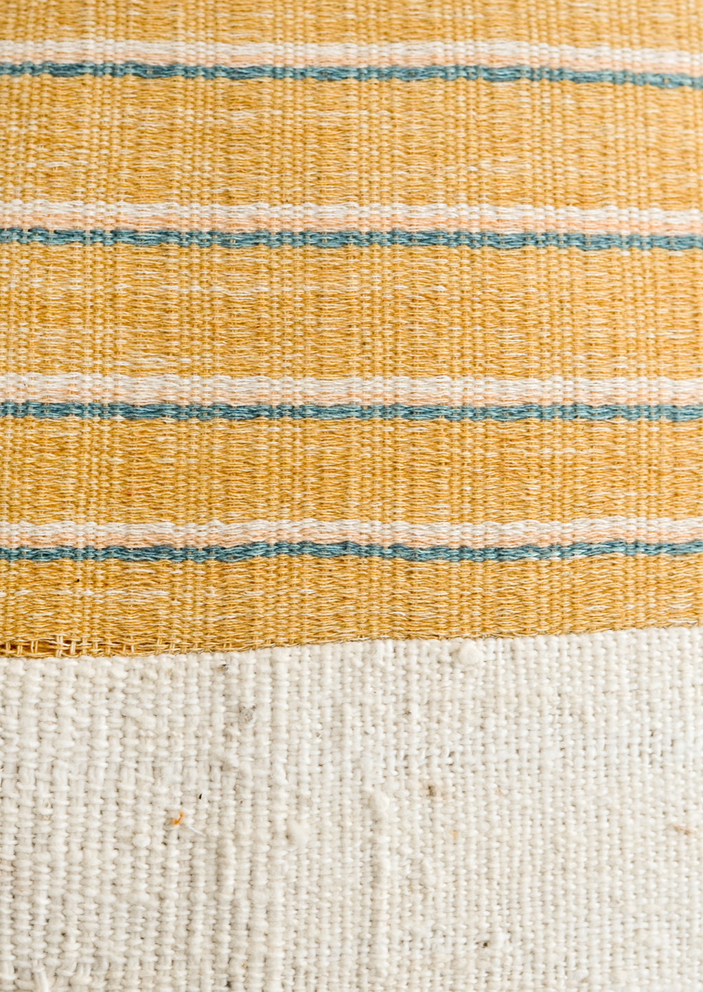 4: A mustard, ivory, peach and turquoise striped fabric combined with natural mudcloth fabric.