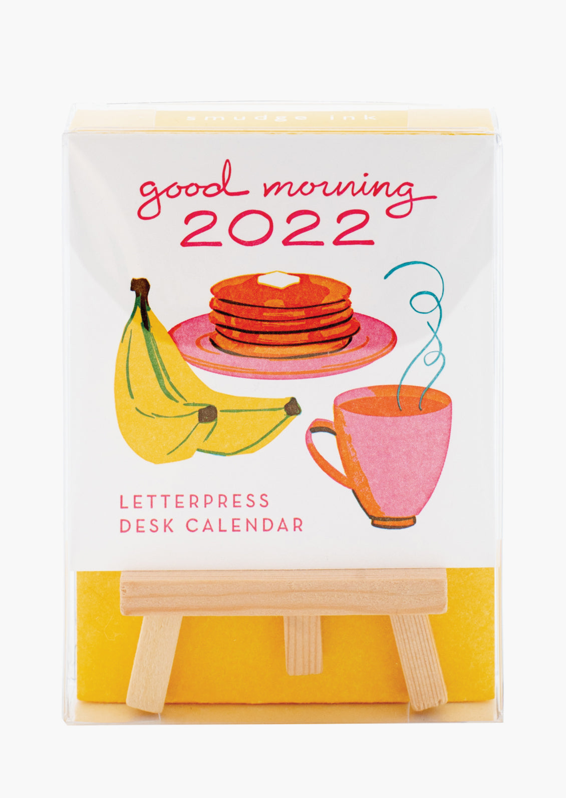 A set of calendar cards with breakfast theme, and wooden stand.