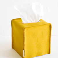 Cube / Dijon: Cube-shaped tissue box cover made from felted wool in mustard color with leather accents