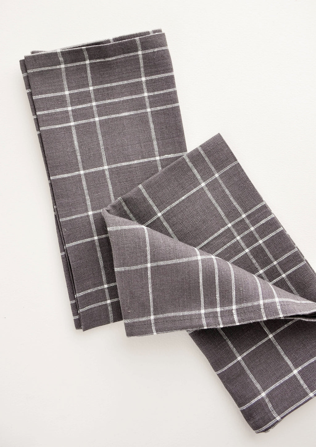 Charcoal Grid: Pair of fabric dinner napkins in grey and white grid pattern