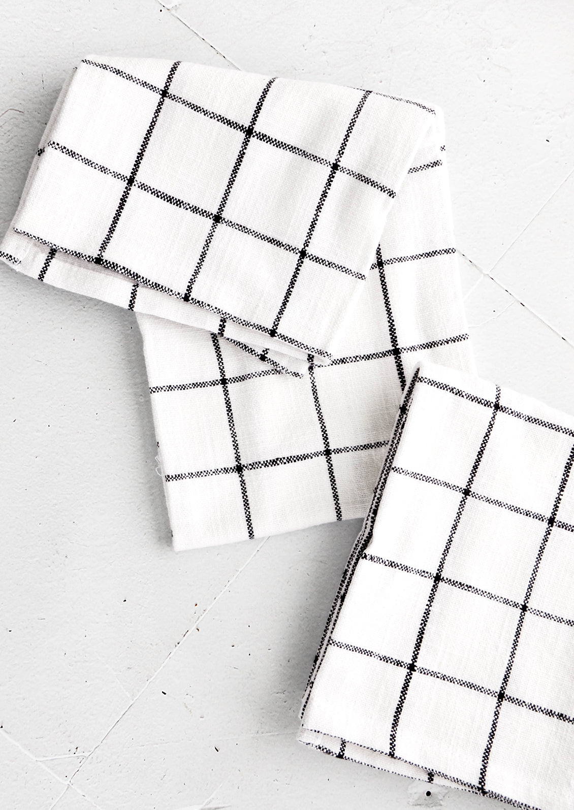 Cotton kitchen towel in white with black check pattern