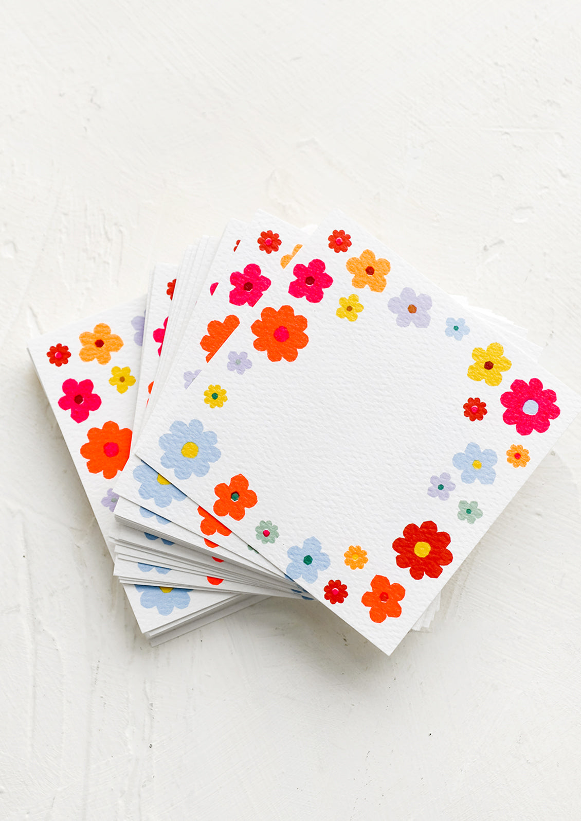 Mini square notecards with floral border.