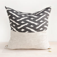 2: Square throw pillow in reversible design with contrasting black and white fabric on front and back