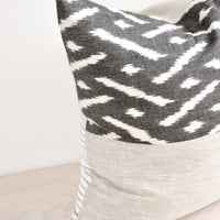 1: Square throw pillow in reversible design with contrasting black and white fabric on front and back