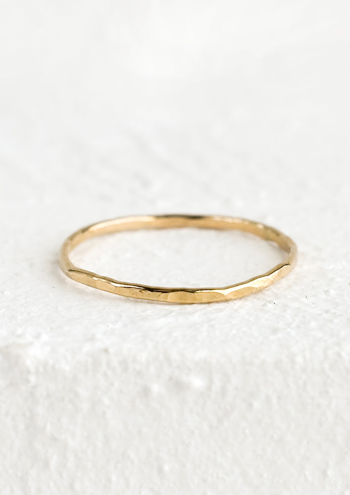 1: A thin hammered stacking ring in gold.