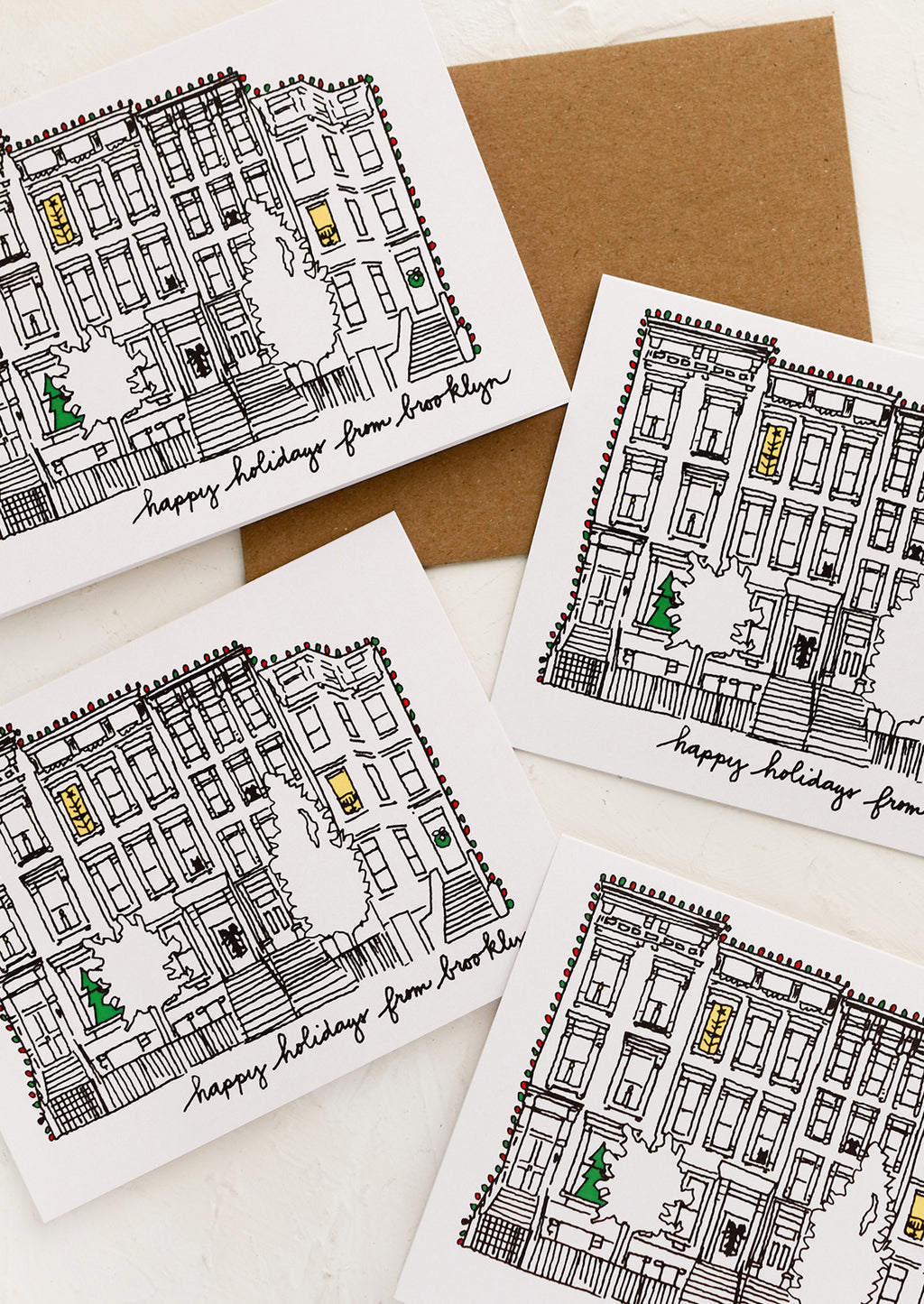 Boxed Set Of 8: A set of cards with drawing of brownstone and text reading "Happy holidays from Brooklyn".