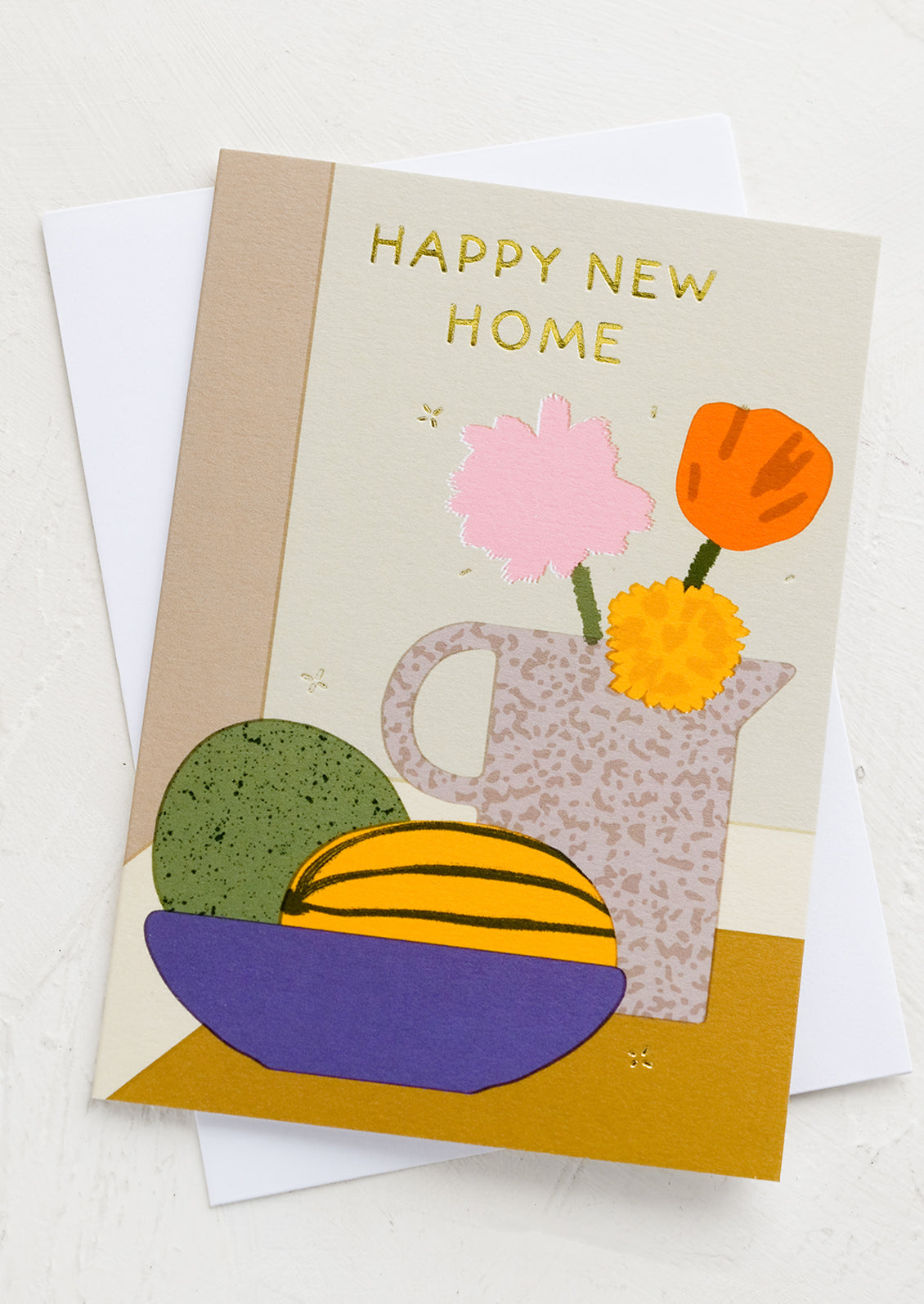 A greeting card with still life imagery and text reading "Happy new home".