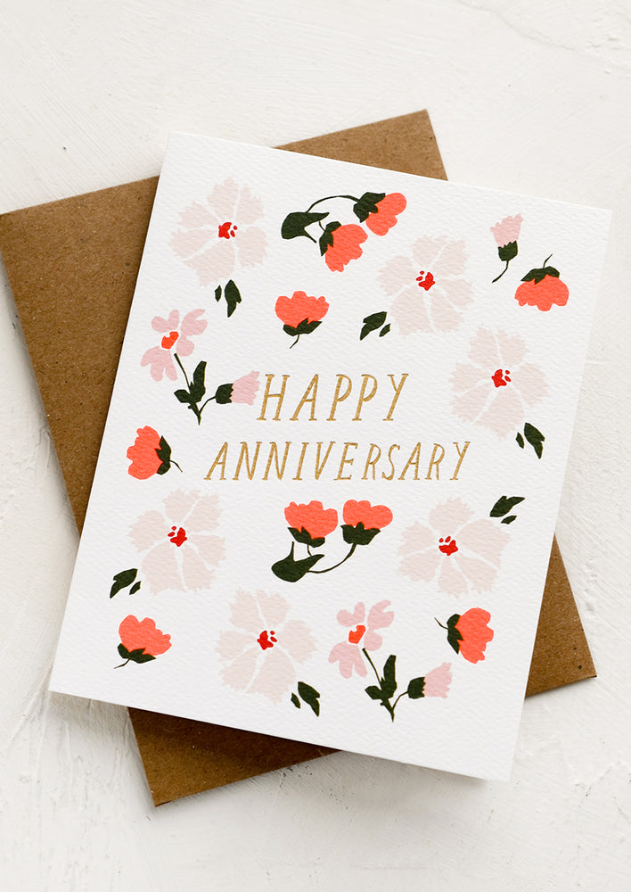 1: An anniversary greeting card with floral print.