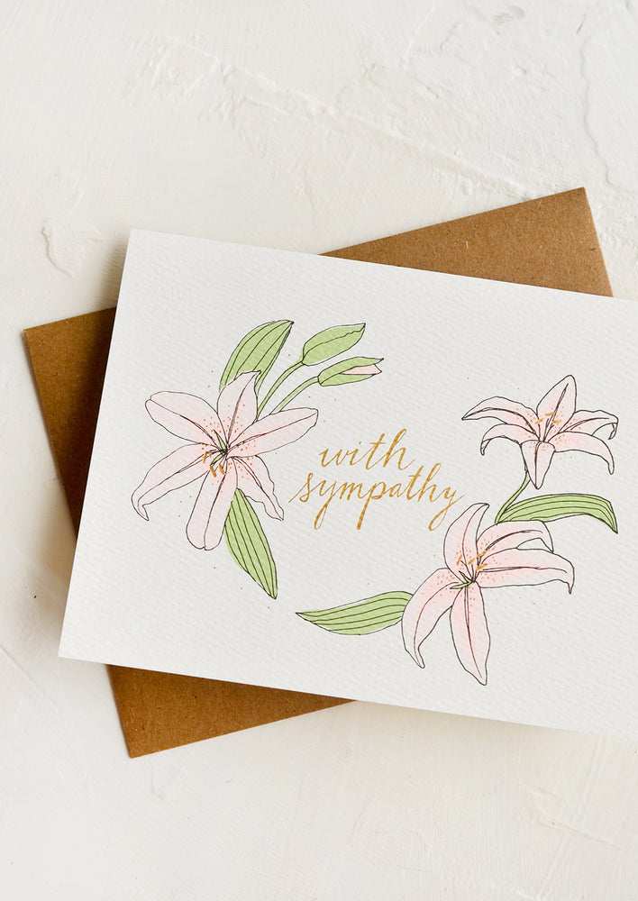 1: A sympathy greeting card with illustrated lilies and text at middle reads "With sympathy"