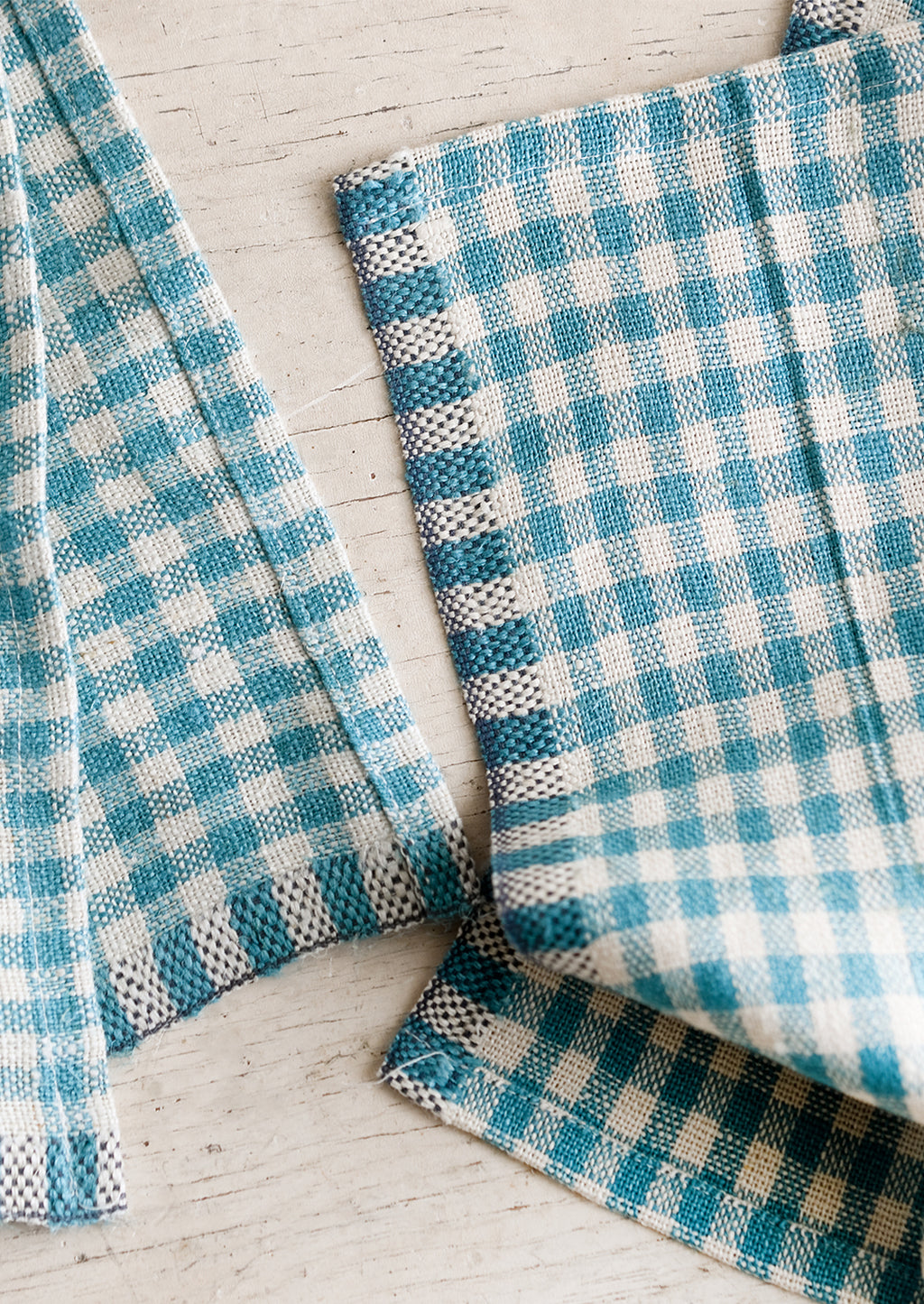 Picnic Blue: A pair of turquoise gingham cocktail napkins.
