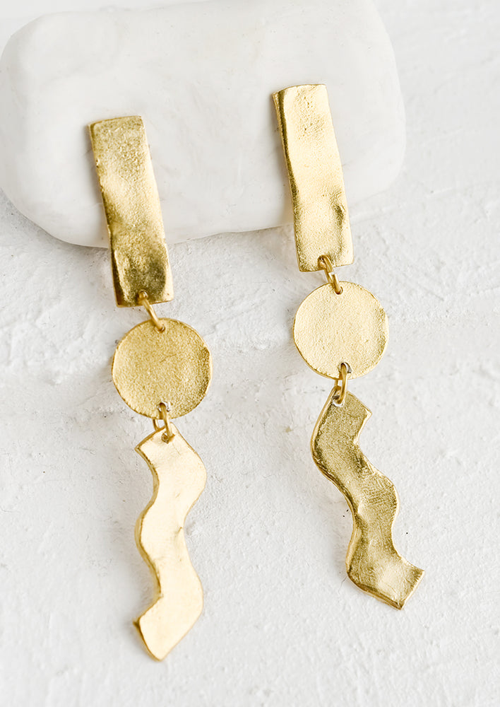 1: A pair of gold earrings in long skinny geometric design.