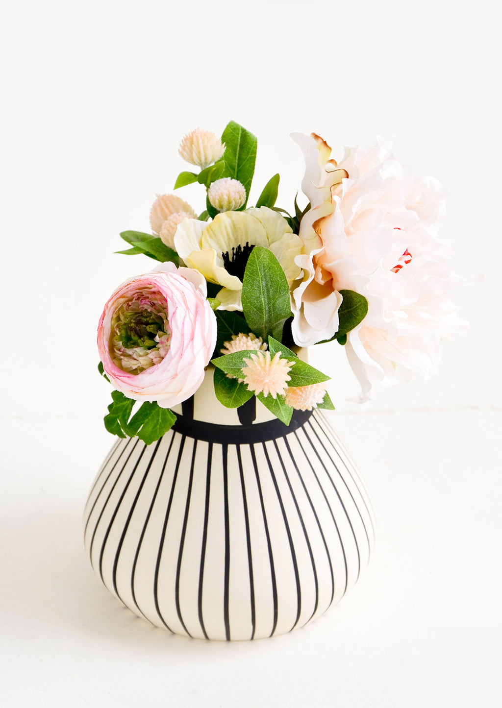 2: Black & white striped ceramic vase with a bouquet of flowers